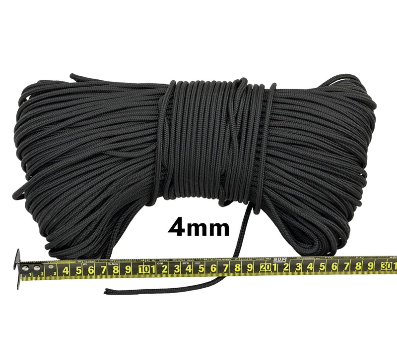 Cargue la imagen en el visor de la galería, Piola cuerda de polipropileno negra. Vista superior de madeja de un kilogramo piola cuerda de polipropileno negra de 4 milímetros de grosor, con regla métrica de medición visible.
