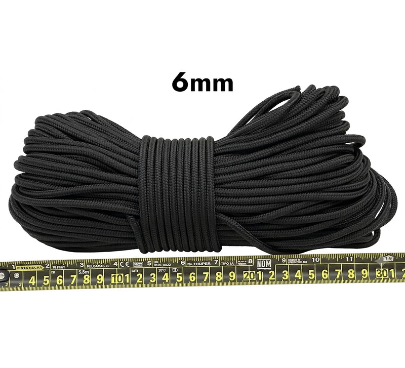 Cargue la imagen en el visor de la galería, Piola cuerda de polipropileno negra.  Vista lateral de madeja de un kilogramo piola cuerda de polipropileno negra de 6 milímetros de grosor, con regla métrica de medición visible.
